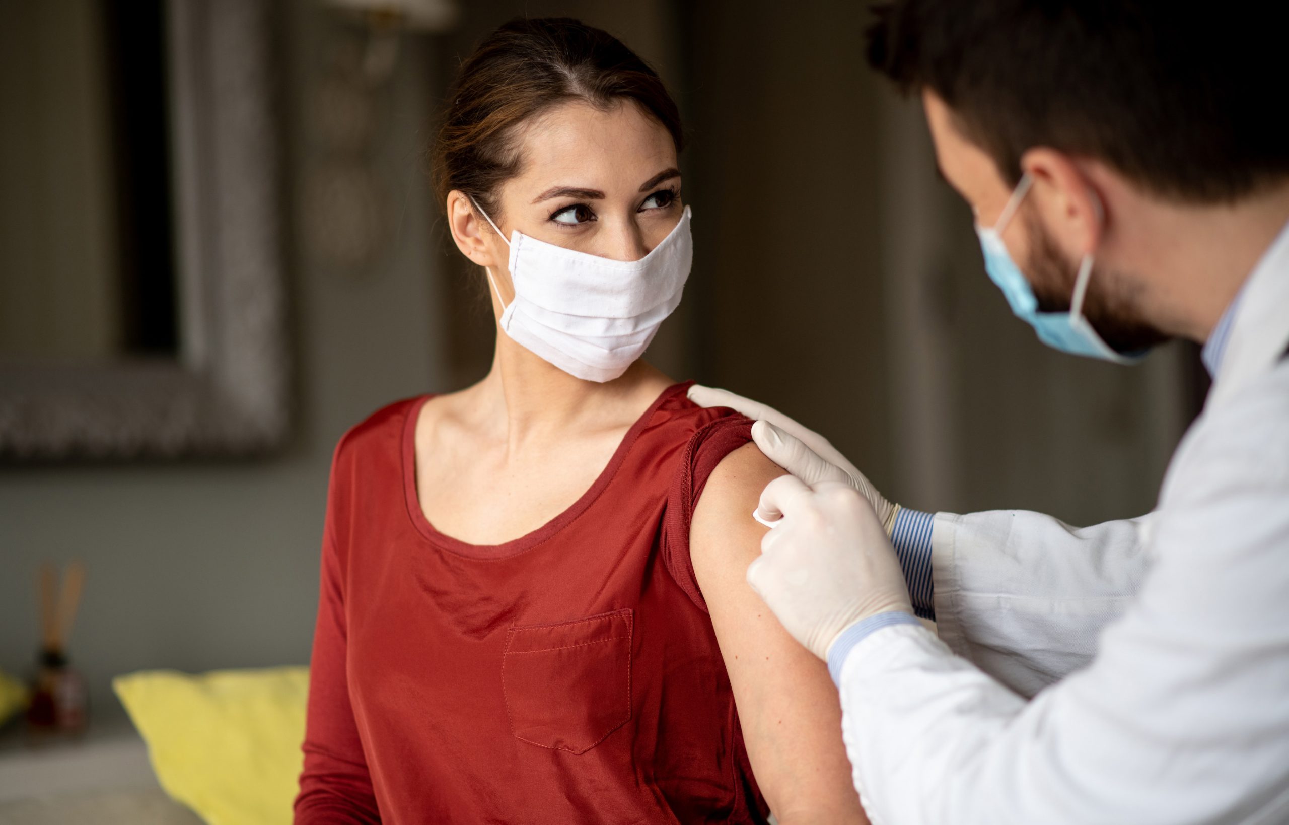 Woman getting a flu shot at MDNow